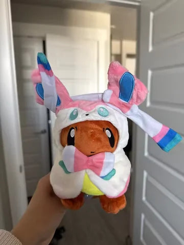 Customer holding the pink ribbon plush for scale