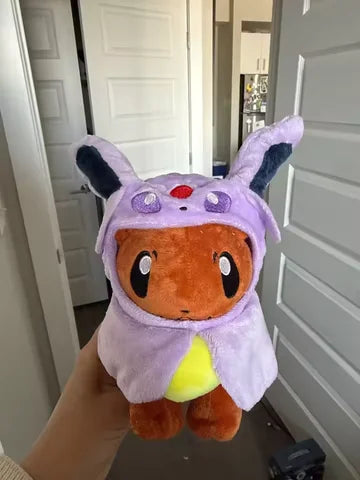 Customer holding the lavender hood plush for scale