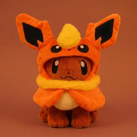 Full view of plush with an orange hood and fluffy yellow collar, included in the complete set
