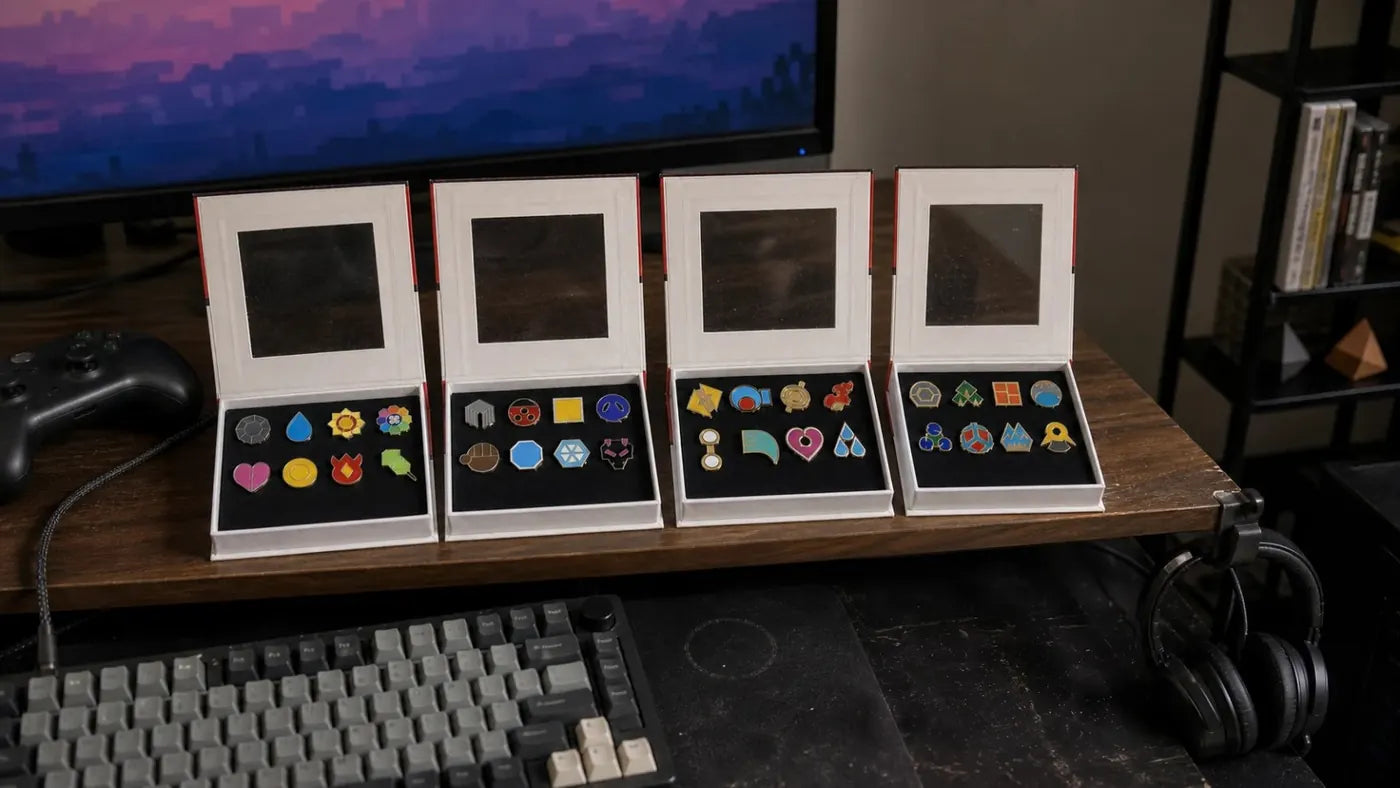 The four gift boxes open side by side on a wooden desk, Kanto, Johto, Hoenn and Sinnoh, eight badges in each