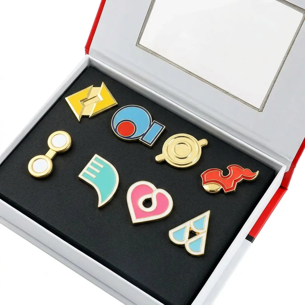Hoenn gift box open, eight enamel badges in two rows on black foam